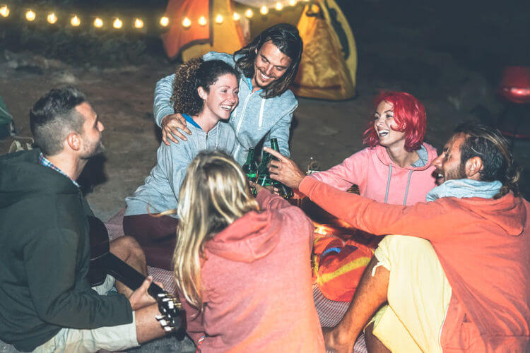 Group of friends camping at a festival