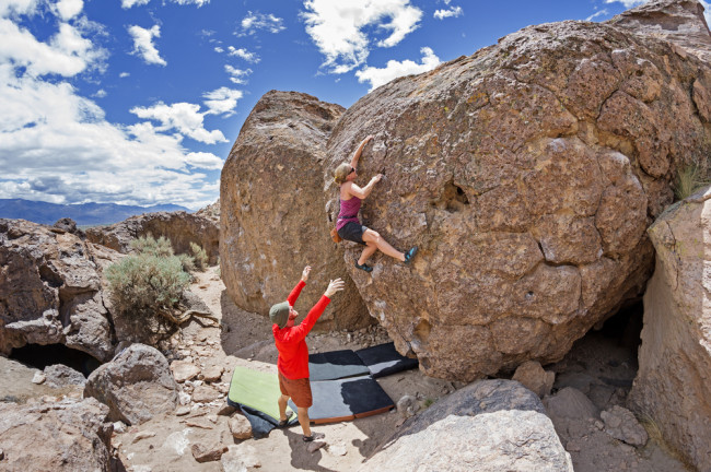 man and woman bouldering