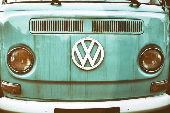front of a green vw camper