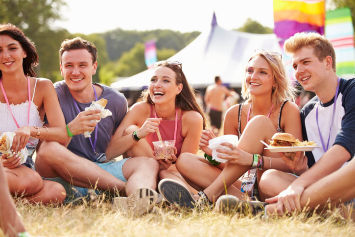 Young people eating at a music festival