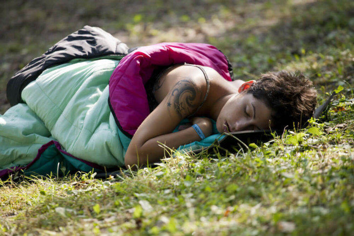 Woman sleeping at a music festival