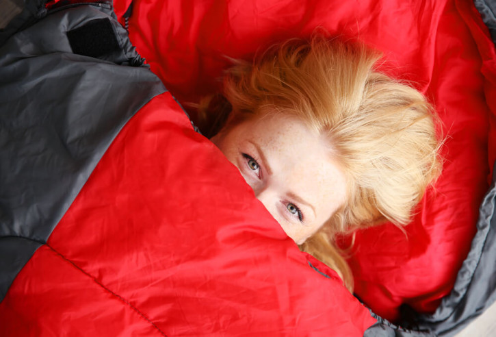 Woman in a red sleeping bag